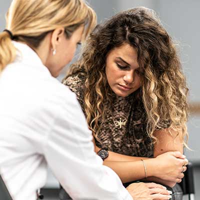 Female teen talking with doctor